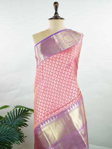 Kanchipuram Silk A masterpiece from Kanchipuram, this Kanjivaram saree in Hot Pink is a tribute to India's rich handloom legacy. The Pure Zari weaving and Buttis motifs make it a perfect choice for brides and celebrations. Every thread speaks of elegance, tradition, and the skilled hands that bring this saree to life. Bhairavi - Manoranjitham Weaves - Handloom Store