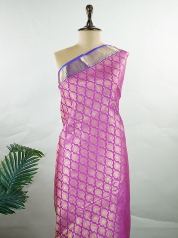 Kanchipuram Silk A masterpiece from Kanchipuram, this Kanjivaram saree in Pink is a tribute to India's rich handloom legacy. The Pure Zari weaving and Buttis motifs make it a perfect choice for brides and celebrations. Every thread speaks of elegance, tradition, and the skilled hands that bring this saree to life. Dwijavanthi - Manoranjitham Weaves - Handloom Store