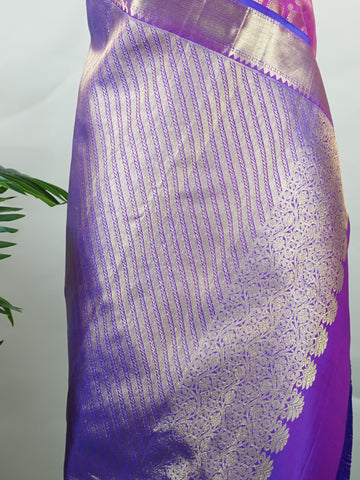 Kanchipuram Silk A masterpiece from Kanchipuram, this Kanjivaram saree in Pink is a tribute to India's rich handloom legacy. The Pure Zari weaving and Buttis motifs make it a perfect choice for brides and celebrations. Every thread speaks of elegance, tradition, and the skilled hands that bring this saree to life. Dwijavanthi - Manoranjitham Weaves - Handloom Store