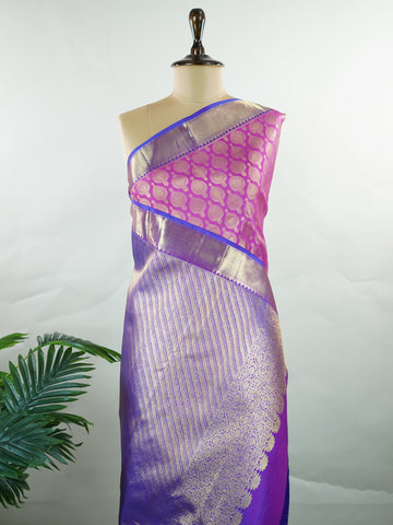 Kanchipuram Silk A masterpiece from Kanchipuram, this Kanjivaram saree in Pink is a tribute to India's rich handloom legacy. The Pure Zari weaving and Buttis motifs make it a perfect choice for brides and celebrations. Every thread speaks of elegance, tradition, and the skilled hands that bring this saree to life. Dwijavanthi - Manoranjitham Weaves - Handloom Store