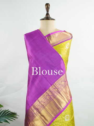 Kanchipuram Silk This Kanjivaram silk saree, adorned in Olive Green and detailed with Pure Zari weaving, reflects the grandeur of Kanchipuram. The timeless Buttis motifs enhance its bridal charm. A perfect blend of luxury and tradition, it is designed for those who appreciate fine craftsmanship. Sahana - Olive Pure Kanjivaram Silk Saree | Pure Zari - Manoranjitham Weaves - Handloom Store