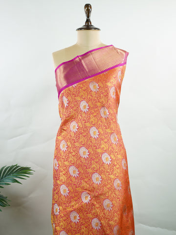 Kanchipuram Silk Handwoven by skilled artisans of Kanchipuram, this Kanjivaram saree in Orange blends traditional elegance with intricate Pure Zari zari work. A truly stunning drape for special occasions. The interplay of colors and craftsmanship makes it a treasured piece for every saree connoisseur. Suratia - Orange Pure Kanjivaram Silk Saree | Pure Zari - Manoranjitham Weaves - Handloom Store