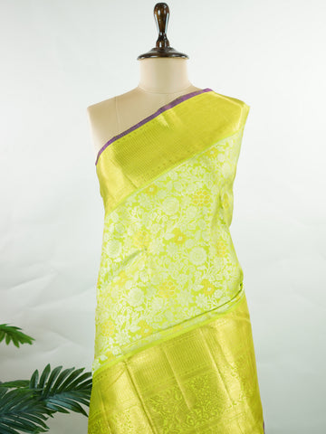 Kanchipuram Silk A masterpiece from Kanchipuram, this Kanjivaram saree in Green is a tribute to India's rich handloom legacy. The Pure Zari weaving and Buttis motifs make it a perfect choice for brides and celebrations. Every thread speaks of elegance, tradition, and the skilled hands that bring this saree to life. Sindhu - Manoranjitham Weaves - Handloom Store