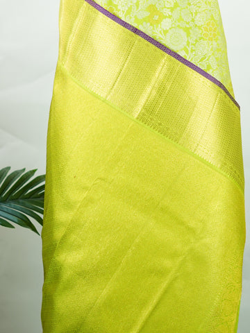 Kanchipuram Silk A masterpiece from Kanchipuram, this Kanjivaram saree in Green is a tribute to India's rich handloom legacy. The Pure Zari weaving and Buttis motifs make it a perfect choice for brides and celebrations. Every thread speaks of elegance, tradition, and the skilled hands that bring this saree to life. Sindhu - Manoranjitham Weaves - Handloom Store