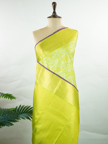 Kanchipuram Silk A masterpiece from Kanchipuram, this Kanjivaram saree in Green is a tribute to India's rich handloom legacy. The Pure Zari weaving and Buttis motifs make it a perfect choice for brides and celebrations. Every thread speaks of elegance, tradition, and the skilled hands that bring this saree to life. Sindhu - Manoranjitham Weaves - Handloom Store