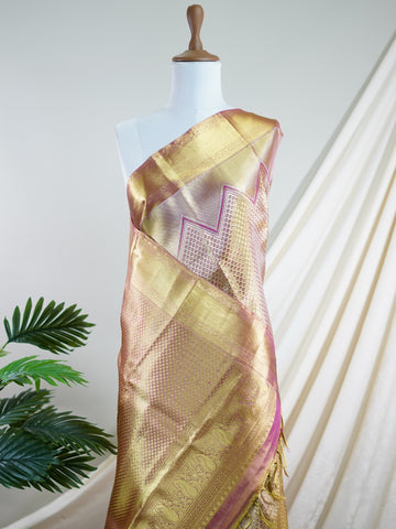 Kanchipuram Silk This Kanjivaram silk saree, adorned in Ivory  and detailed with Pure Zari weaving, reflects the grandeur of Kanchipuram. The timeless Buttis motifs enhance its bridal charm. A perfect blend of luxury and tradition, it is designed for those who appreciate fine craftsmanship. Pantuvarali - Ivory Pure Kanjivaram Silk Saree | Pure Zari - Manoranjitham Weaves - Handloom Store