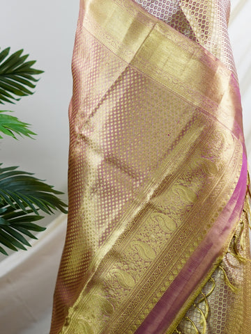 Kanchipuram Silk This Kanjivaram silk saree, adorned in Ivory  and detailed with Pure Zari weaving, reflects the grandeur of Kanchipuram. The timeless Buttis motifs enhance its bridal charm. A perfect blend of luxury and tradition, it is designed for those who appreciate fine craftsmanship. Pantuvarali - Ivory Pure Kanjivaram Silk Saree | Pure Zari - Manoranjitham Weaves - Handloom Store