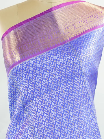 Kanchipuram Silk A masterpiece from Kanchipuram, this Kanjivaram saree in Royal Blue is a tribute to India's rich handloom legacy. The Pure Zari weaving and Buttis motifs make it a perfect choice for brides and celebrations. Every thread speaks of elegance, tradition, and the skilled hands that bring this saree to life. Bilaharia - Royal Blue Pure Kanjivaram Silk Saree | Pure Zari - Manoranjitham Weaves - Handloom Store