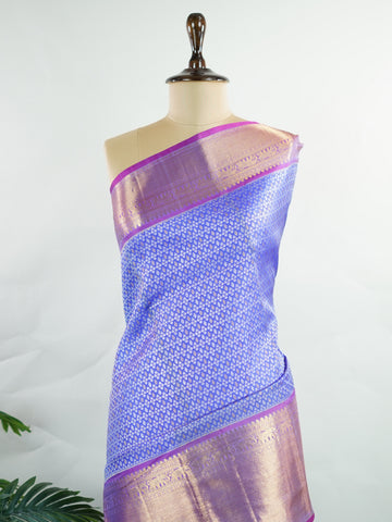 Kanchipuram Silk A masterpiece from Kanchipuram, this Kanjivaram saree in Royal Blue is a tribute to India's rich handloom legacy. The Pure Zari weaving and Buttis motifs make it a perfect choice for brides and celebrations. Every thread speaks of elegance, tradition, and the skilled hands that bring this saree to life. Bilaharia - Royal Blue Pure Kanjivaram Silk Saree | Pure Zari - Manoranjitham Weaves - Handloom Store