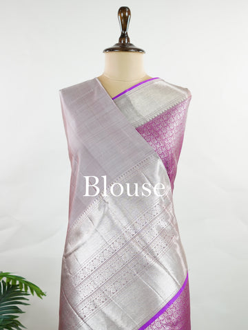 Kanchipuram Silk This Kanjivaram silk saree, adorned in Magenta and detailed with Pure Zari weaving, reflects the grandeur of Kanchipuram. The timeless Buttis motifs enhance its bridal charm. A perfect blend of luxury and tradition, it is designed for those who appreciate fine craftsmanship. Begadaa - Magenta Pure Kanjivaram Silk Saree | Pure Zari - Manoranjitham Weaves - Handloom Store