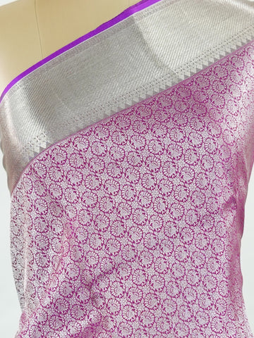Kanchipuram Silk This Kanjivaram silk saree, adorned in Magenta and detailed with Pure Zari weaving, reflects the grandeur of Kanchipuram. The timeless Buttis motifs enhance its bridal charm. A perfect blend of luxury and tradition, it is designed for those who appreciate fine craftsmanship. Begadaa - Magenta Pure Kanjivaram Silk Saree | Pure Zari - Manoranjitham Weaves - Handloom Store