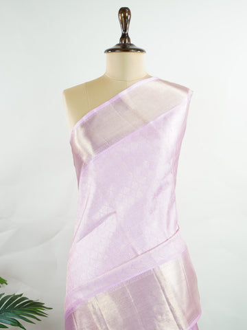 Kanchipuram Silk Handwoven by skilled artisans of Kanchipuram, this Kanjivaram saree in Peach Pink blends traditional elegance with intricate Pure Zari zari work. A truly stunning drape for special occasions. The interplay of colors and craftsmanship makes it a treasured piece for every saree connoisseur. Charukesi - Peach Pure Kanjivaram Silk Saree | Pure Zari - Manoranjitham Weaves - Handloom Store