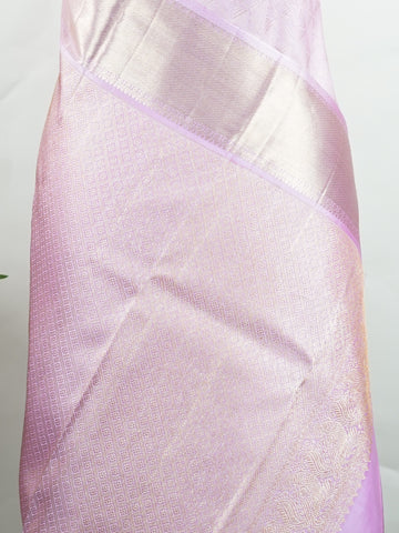 Kanchipuram Silk Handwoven by skilled artisans of Kanchipuram, this Kanjivaram saree in Peach Pink blends traditional elegance with intricate Pure Zari zari work. A truly stunning drape for special occasions. The interplay of colors and craftsmanship makes it a treasured piece for every saree connoisseur. Charukesi - Peach Pure Kanjivaram Silk Saree | Pure Zari - Manoranjitham Weaves - Handloom Store