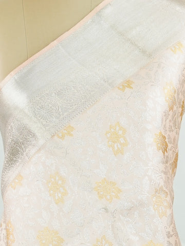Kanchipuram Silk A masterpiece from Kanchipuram, this Kanjivaram saree in Ivory is a tribute to India's rich handloom legacy. The Pure Zari weaving and Buttis motifs make it a perfect choice for brides and celebrations. Every thread speaks of elegance, tradition, and the skilled hands that bring this saree to life. Hamsadhwani - Ivory Pure Kanjivaram Silk Saree | Pure Zari - Manoranjitham Weaves - Handloom Store