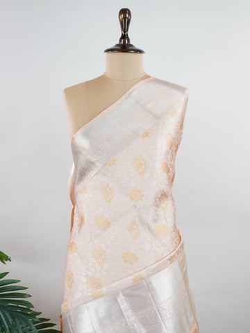 Kanchipuram Silk A masterpiece from Kanchipuram, this Kanjivaram saree in Ivory is a tribute to India's rich handloom legacy. The Pure Zari weaving and Buttis motifs make it a perfect choice for brides and celebrations. Every thread speaks of elegance, tradition, and the skilled hands that bring this saree to life. Hamsadhwani - Ivory Pure Kanjivaram Silk Saree | Pure Zari - Manoranjitham Weaves - Handloom Store