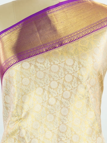 Kanchipuram Silk A masterpiece from Kanchipuram, this Kanjivaram saree in Golden Yellow is a tribute to India's rich handloom legacy. The Pure Zari weaving and Buttis motifs make it a perfect choice for brides and celebrations. Every thread speaks of elegance, tradition, and the skilled hands that bring this saree to life. Latangi - Pure Kanjivaram Silk Saree | Pure Zari - Manoranjitham Weaves - Handloom Store
