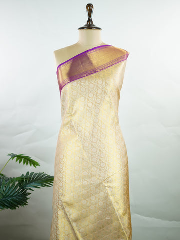 Kanchipuram Silk A masterpiece from Kanchipuram, this Kanjivaram saree in Golden Yellow is a tribute to India's rich handloom legacy. The Pure Zari weaving and Buttis motifs make it a perfect choice for brides and celebrations. Every thread speaks of elegance, tradition, and the skilled hands that bring this saree to life. Latangi - Pure Kanjivaram Silk Saree | Pure Zari - Manoranjitham Weaves - Handloom Store