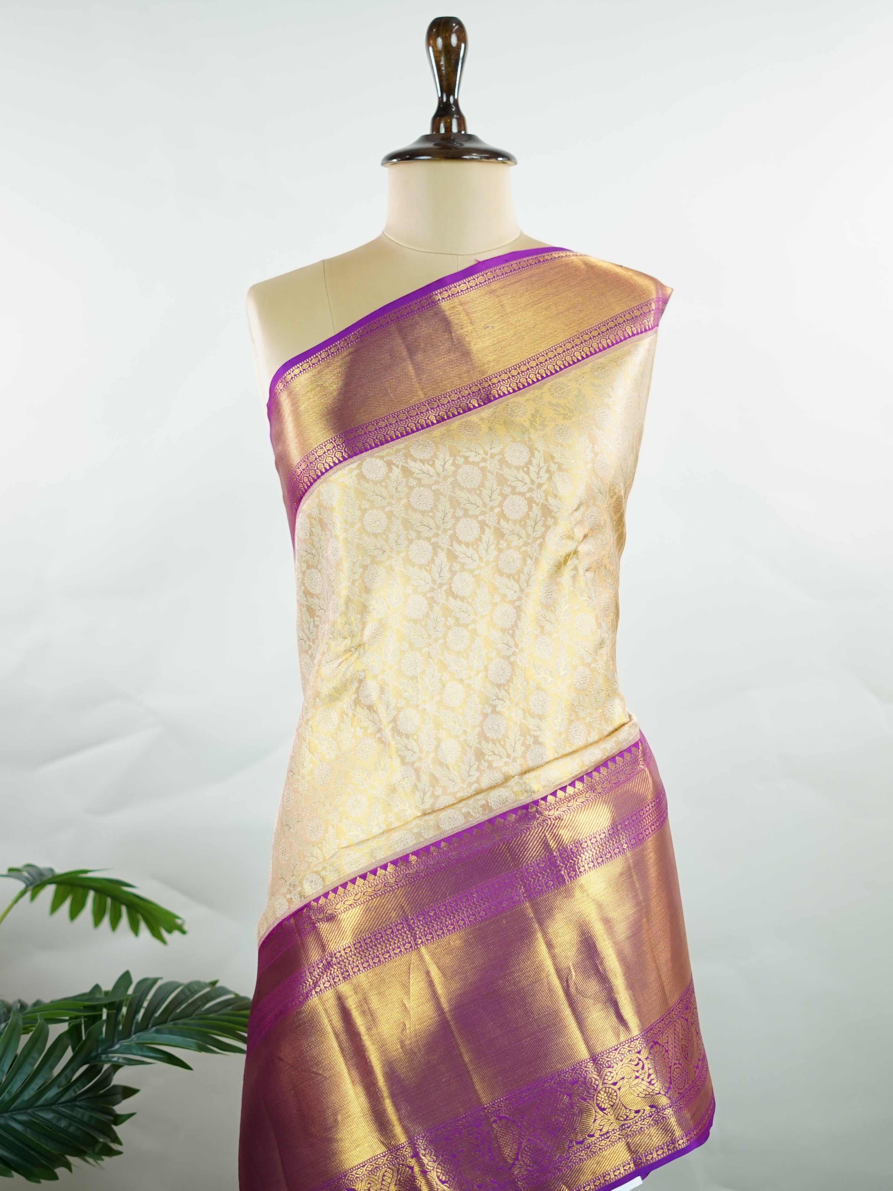 Kanchipuram Silk A masterpiece from Kanchipuram, this Kanjivaram saree in Golden Yellow is a tribute to India's rich handloom legacy. The Pure Zari weaving and Buttis motifs make it a perfect choice for brides and celebrations. Every thread speaks of elegance, tradition, and the skilled hands that bring this saree to life. Latangi - Pure Kanjivaram Silk Saree | Pure Zari - Manoranjitham Weaves - Handloom Store