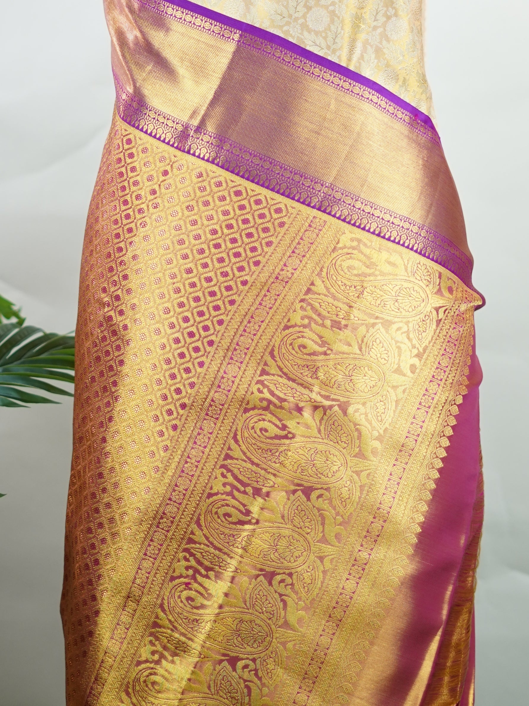 Kanchipuram Silk A masterpiece from Kanchipuram, this Kanjivaram saree in Golden Yellow is a tribute to India's rich handloom legacy. The Pure Zari weaving and Buttis motifs make it a perfect choice for brides and celebrations. Every thread speaks of elegance, tradition, and the skilled hands that bring this saree to life. Latangi - Pure Kanjivaram Silk Saree | Pure Zari - Manoranjitham Weaves - Handloom Store