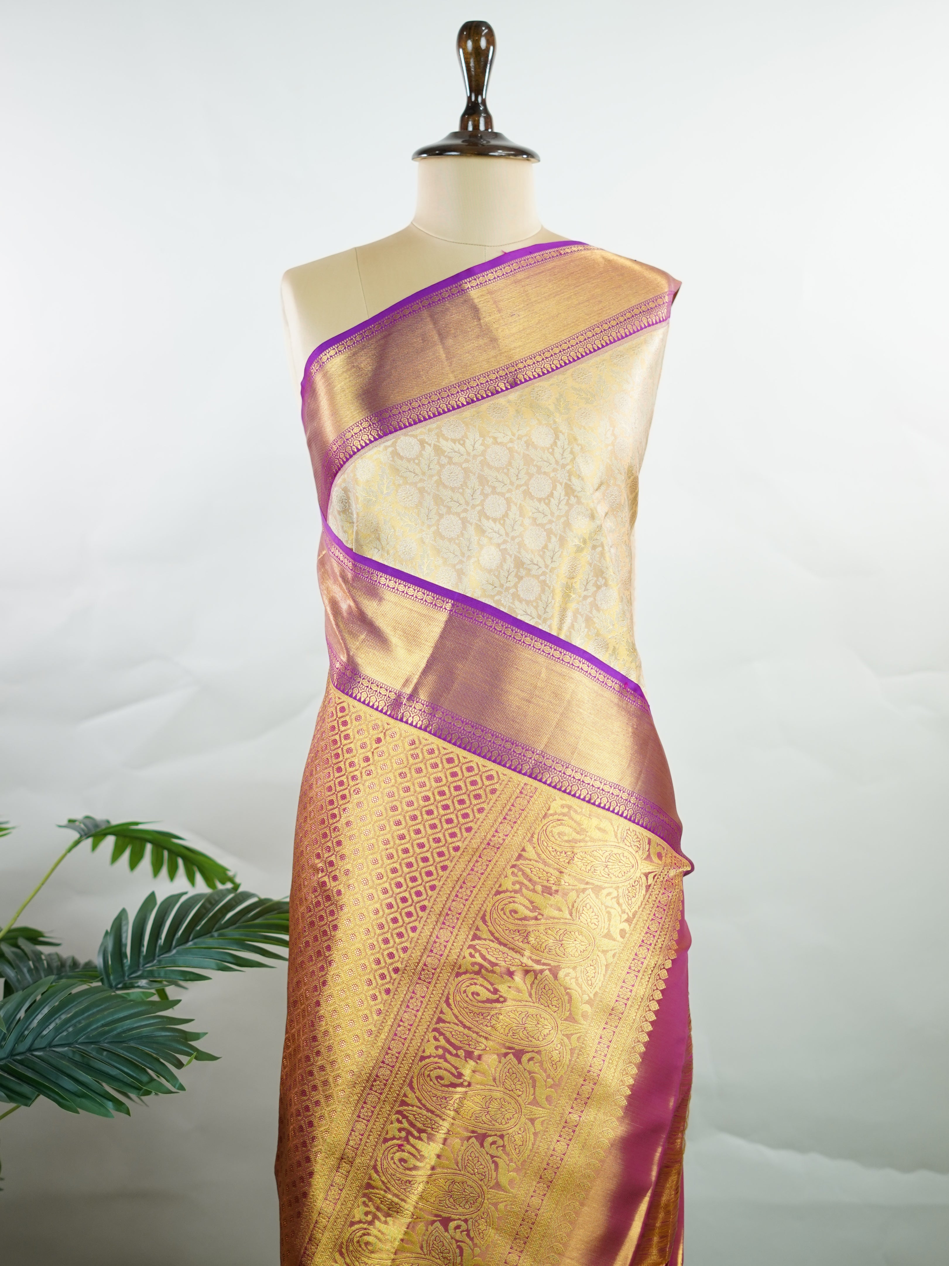 Kanchipuram Silk A masterpiece from Kanchipuram, this Kanjivaram saree in Golden Yellow is a tribute to India's rich handloom legacy. The Pure Zari weaving and Buttis motifs make it a perfect choice for brides and celebrations. Every thread speaks of elegance, tradition, and the skilled hands that bring this saree to life. Latangi - Pure Kanjivaram Silk Saree | Pure Zari - Manoranjitham Weaves - Handloom Store