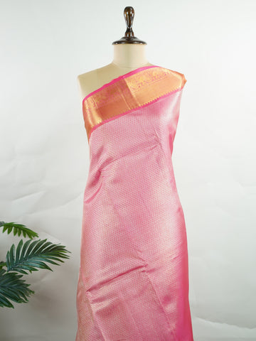 Kanchipuram Silk This 100% Pure Silk  silk saree, adorned in Hot Pink and detailed with Pure Zari weaving, reflects the grandeur of Maharashtra. The timeless Buttis motifs enhance its bridal charm. A perfect blend of luxury and tradition, it is designed for those who appreciate fine craftsmanship. Bageshree - Pure Kanjivaram Silk Saree | Pure Zari - Manoranjitham Weaves - Handloom Store