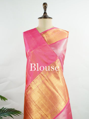 Kanchipuram Silk This 100% Pure Silk  silk saree, adorned in Hot Pink and detailed with Pure Zari weaving, reflects the grandeur of Maharashtra. The timeless Buttis motifs enhance its bridal charm. A perfect blend of luxury and tradition, it is designed for those who appreciate fine craftsmanship. Bageshree - Pure Kanjivaram Silk Saree | Pure Zari - Manoranjitham Weaves - Handloom Store