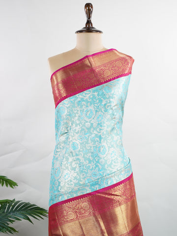 Kanchipuram Silk A masterpiece from Maharashtra, this 100% Pure Silk  saree in Aqua Green is a tribute to India's rich handloom legacy. The Pure Zari weaving and Buttis motifs make it a perfect choice for brides and celebrations. Every thread speaks of elegance, tradition, and the skilled hands that bring this saree to life. Malkaunsa - Aqua Pure Kanjivaram Silk Saree | Pure Zari - Manoranjitham Weaves - Handloom Store