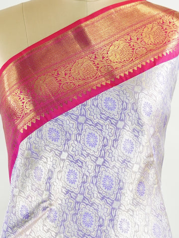Kanchipuram Silk Handwoven by skilled artisans of Maharashtra, this 100% Pure Silk  saree in Lilac blends traditional elegance with intricate Pure Zari zari work. A truly stunning drape for special occasions. The interplay of colors and craftsmanship makes it a treasured piece for every saree connoisseur. Patdeepa - Pure Kanjivaram Silk Saree | Pure Zari - Manoranjitham Weaves - Handloom Store