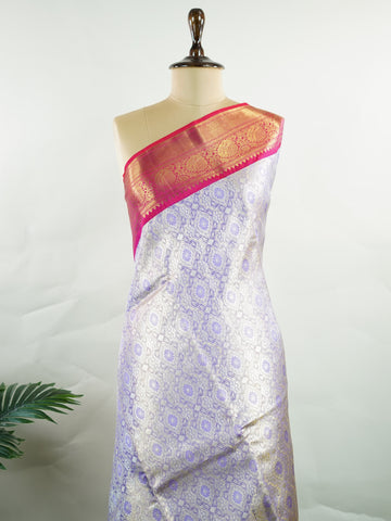 Kanchipuram Silk Handwoven by skilled artisans of Maharashtra, this 100% Pure Silk  saree in Lilac blends traditional elegance with intricate Pure Zari zari work. A truly stunning drape for special occasions. The interplay of colors and craftsmanship makes it a treasured piece for every saree connoisseur. Patdeepa - Pure Kanjivaram Silk Saree | Pure Zari - Manoranjitham Weaves - Handloom Store