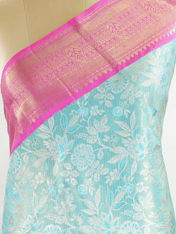 Kanchipuram Silk Handwoven by skilled artisans of Maharashtra, this 100% Pure Silk  saree in Aqua Green blends traditional elegance with intricate Pure Zari zari work. A truly stunning drape for special occasions. The interplay of colors and craftsmanship makes it a treasured piece for every saree connoisseur. Joga - Aqua Pure Kanjivaram Silk Saree | Pure Zari - Manoranjitham Weaves - Handloom Store