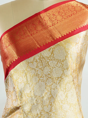 Kanchipuram Silk Handwoven by skilled artisans of Maharashtra, this 100% Pure Silk  saree in Mustard Yellow blends traditional elegance with intricate Pure Zari zari work. A truly stunning drape for special occasions. The interplay of colors and craftsmanship makes it a treasured piece for every saree connoisseur. Gaud - Mustard Yellow Pure Kanjivaram Silk Saree | Pure Zari - Manoranjitham Weaves - Handloom Store