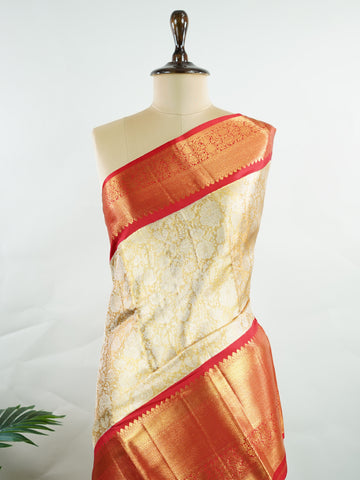 Kanchipuram Silk Handwoven by skilled artisans of Maharashtra, this 100% Pure Silk  saree in Mustard Yellow blends traditional elegance with intricate Pure Zari zari work. A truly stunning drape for special occasions. The interplay of colors and craftsmanship makes it a treasured piece for every saree connoisseur. Gaud - Mustard Yellow Pure Kanjivaram Silk Saree | Pure Zari - Manoranjitham Weaves - Handloom Store
