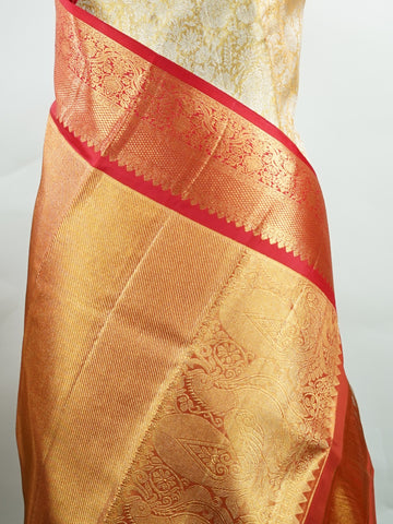 Kanchipuram Silk Handwoven by skilled artisans of Maharashtra, this 100% Pure Silk  saree in Mustard Yellow blends traditional elegance with intricate Pure Zari zari work. A truly stunning drape for special occasions. The interplay of colors and craftsmanship makes it a treasured piece for every saree connoisseur. Gaud - Mustard Yellow Pure Kanjivaram Silk Saree | Pure Zari - Manoranjitham Weaves - Handloom Store