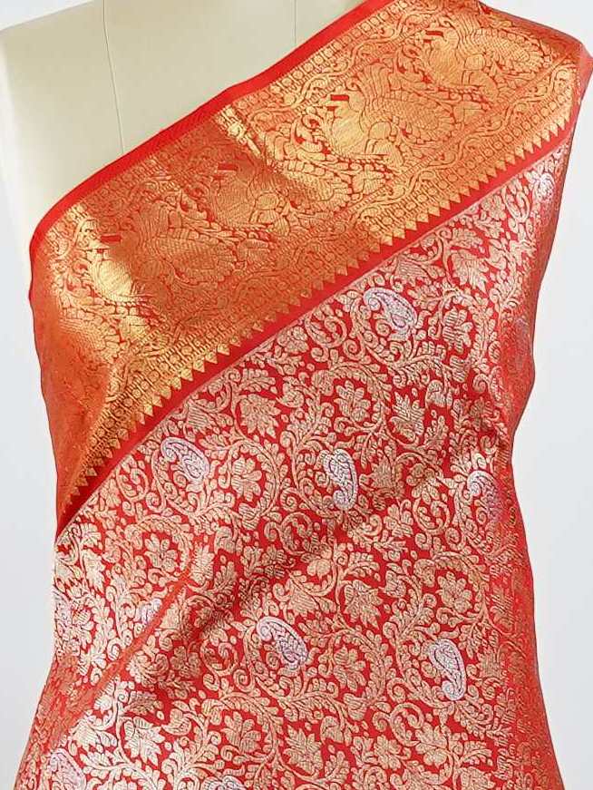 Kanchipuram Silk This 100% Pure Silk  silk saree, adorned in Red and detailed with Pure Zari weaving, reflects the grandeur of Maharashtra. The timeless Buttis motifs enhance its bridal charm. A perfect blend of luxury and tradition, it is designed for those who appreciate fine craftsmanship. Hemanta - Red Pure Kanjivaram Silk Saree | Pure Zari - Manoranjitham Weaves - Handloom Store