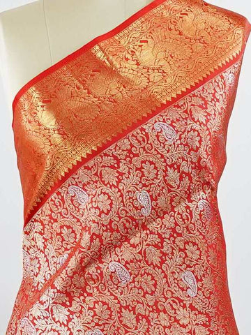 Kanchipuram Silk This 100% Pure Silk  silk saree, adorned in Red and detailed with Pure Zari weaving, reflects the grandeur of Maharashtra. The timeless Buttis motifs enhance its bridal charm. A perfect blend of luxury and tradition, it is designed for those who appreciate fine craftsmanship. Hemanta - Red Pure Kanjivaram Silk Saree | Pure Zari - Manoranjitham Weaves - Handloom Store