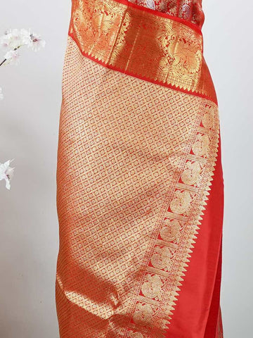 Kanchipuram Silk This 100% Pure Silk  silk saree, adorned in Red and detailed with Pure Zari weaving, reflects the grandeur of Maharashtra. The timeless Buttis motifs enhance its bridal charm. A perfect blend of luxury and tradition, it is designed for those who appreciate fine craftsmanship. Hemanta - Red Pure Kanjivaram Silk Saree | Pure Zari - Manoranjitham Weaves - Handloom Store