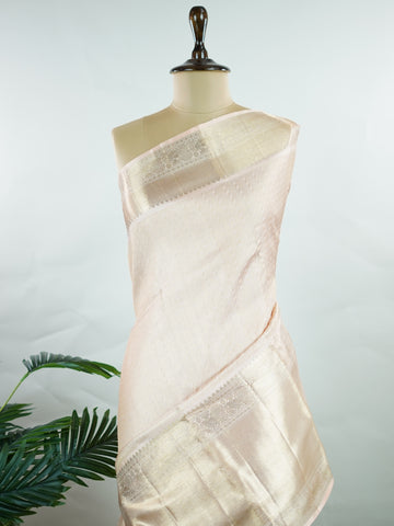 Kanchipuram Silk This 100% Pure Silk  silk saree, adorned in Peach and detailed with Pure Zari weaving, reflects the grandeur of Maharashtra. The timeless Buttis motifs enhance its bridal charm. A perfect blend of luxury and tradition, it is designed for those who appreciate fine craftsmanship. Rageshree - Peach Pure Kanjivaram Silk Saree | Pure Zari - Manoranjitham Weaves - Handloom Store
