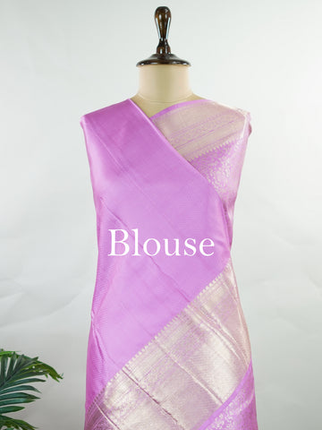 Kanchipuram Silk This 100% Pure Silk  silk saree, adorned in Peony Pink and detailed with Pure Zari weaving, reflects the grandeur of Maharashtra. The timeless Buttis motifs enhance its bridal charm. A perfect blend of luxury and tradition, it is designed for those who appreciate fine craftsmanship. Madhukaunsa - Pure Kanjivaram Silk Saree | Pure Zari - Manoranjitham Weaves - Handloom Store