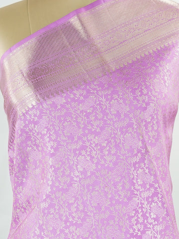 Kanchipuram Silk This 100% Pure Silk  silk saree, adorned in Peony Pink and detailed with Pure Zari weaving, reflects the grandeur of Maharashtra. The timeless Buttis motifs enhance its bridal charm. A perfect blend of luxury and tradition, it is designed for those who appreciate fine craftsmanship. Madhukaunsa - Pure Kanjivaram Silk Saree | Pure Zari - Manoranjitham Weaves - Handloom Store