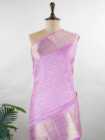 Kanchipuram Silk This 100% Pure Silk  silk saree, adorned in Peony Pink and detailed with Pure Zari weaving, reflects the grandeur of Maharashtra. The timeless Buttis motifs enhance its bridal charm. A perfect blend of luxury and tradition, it is designed for those who appreciate fine craftsmanship. Madhukaunsa - Pure Kanjivaram Silk Saree | Pure Zari - Manoranjitham Weaves - Handloom Store
