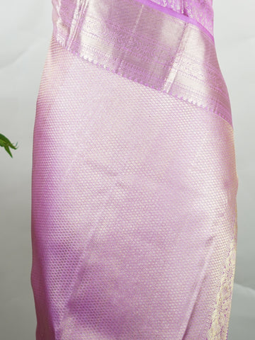 Kanchipuram Silk This 100% Pure Silk  silk saree, adorned in Peony Pink and detailed with Pure Zari weaving, reflects the grandeur of Maharashtra. The timeless Buttis motifs enhance its bridal charm. A perfect blend of luxury and tradition, it is designed for those who appreciate fine craftsmanship. Madhukaunsa - Pure Kanjivaram Silk Saree | Pure Zari - Manoranjitham Weaves - Handloom Store