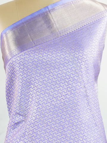 Kanchipuram Silk A masterpiece from Maharashtra, this 100% Pure Silk  saree in Orchid Blue is a tribute to India's rich handloom legacy. The Pure Zari weaving and Buttis motifs make it a perfect choice for brides and celebrations. Every thread speaks of elegance, tradition, and the skilled hands that bring this saree to life. Kaunsi - Pure Kanjivaram Silk Saree | Pure Zari - Manoranjitham Weaves - Handloom Store