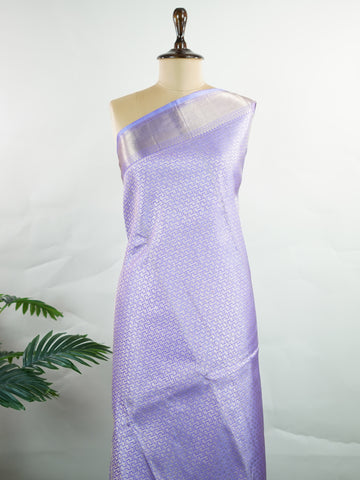 Kanchipuram Silk A masterpiece from Maharashtra, this 100% Pure Silk  saree in Orchid Blue is a tribute to India's rich handloom legacy. The Pure Zari weaving and Buttis motifs make it a perfect choice for brides and celebrations. Every thread speaks of elegance, tradition, and the skilled hands that bring this saree to life. Kaunsi - Pure Kanjivaram Silk Saree | Pure Zari - Manoranjitham Weaves - Handloom Store