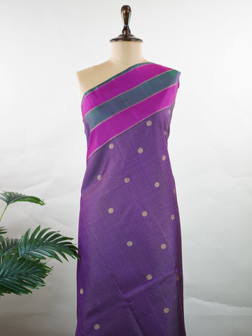 Kanchipuram Silk Experience the elegance of this pure Zari Oosi Kattam saree from Kanchipuram, featuring intricate gold and silver threads woven into a rich purple fabric. The vibrant multi-gap borders in pink and green add a striking contrast, perfect for festive occasions. This masterpiece combines comfort and artistry, making it a timeless choice for celebrations. Padma - Manoranjitham Weaves - Handloom Store