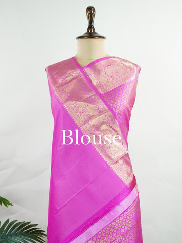 Kanchipuram Silk Beautiful vintage Kanjivaram saree featuring a charming Pink body, perfectly complemented by a matching Pink border and elegant Pink pallu. The monochromatic pink palette exudes grace, femininity, and timeless traditional beauty. Expertly woven with heritage craftsmanship, the saree reflects vintage elegance with a soft and sophisticated appeal. Paired with a plain Pink blouse, this exquisite drape is ideal for weddings, festive celebrations, and special occasions. Vareshni - Pure Kanjivara