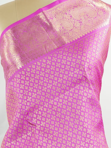Kanchipuram Silk Beautiful vintage Kanjivaram saree featuring a charming Pink body, perfectly complemented by a matching Pink border and elegant Pink pallu. The monochromatic pink palette exudes grace, femininity, and timeless traditional beauty. Expertly woven with heritage craftsmanship, the saree reflects vintage elegance with a soft and sophisticated appeal. Paired with a plain Pink blouse, this exquisite drape is ideal for weddings, festive celebrations, and special occasions. Vareshni - Pure Kanjivara