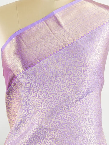Kanchipuram Silk Beautiful bridal Kanjivaram saree featuring a dreamy Lavender body, elegantly paired with a matching Lavender border and graceful Lavender pallu Blouse. The soothing monochromatic palette exudes sophistication, romance, and timeless bridal charm. Expertly woven with exquisite craftsmanship, the saree radiates luxury and elegance with every drape. Paired with a plain Lavender blouse, this enchanting creation is perfect for weddings, receptions, and grand celebrations. Rithviga - Pure Kanjiva