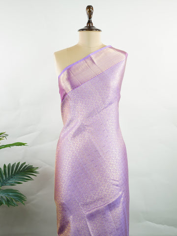 Kanchipuram Silk Beautiful bridal Kanjivaram saree featuring a dreamy Lavender body, elegantly paired with a matching Lavender border and graceful Lavender pallu Blouse. The soothing monochromatic palette exudes sophistication, romance, and timeless bridal charm. Expertly woven with exquisite craftsmanship, the saree radiates luxury and elegance with every drape. Paired with a plain Lavender blouse, this enchanting creation is perfect for weddings, receptions, and grand celebrations. Rithviga - Pure Kanjiva