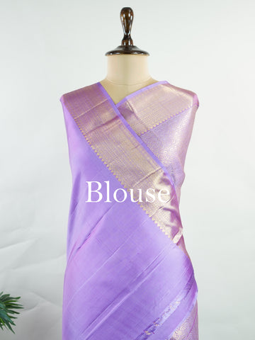 Kanchipuram Silk Beautiful bridal Kanjivaram saree featuring a dreamy Lavender body, elegantly paired with a matching Lavender border and graceful Lavender pallu Blouse. The soothing monochromatic palette exudes sophistication, romance, and timeless bridal charm. Expertly woven with exquisite craftsmanship, the saree radiates luxury and elegance with every drape. Paired with a plain Lavender blouse, this enchanting creation is perfect for weddings, receptions, and grand celebrations. Rithviga - Pure Kanjiva