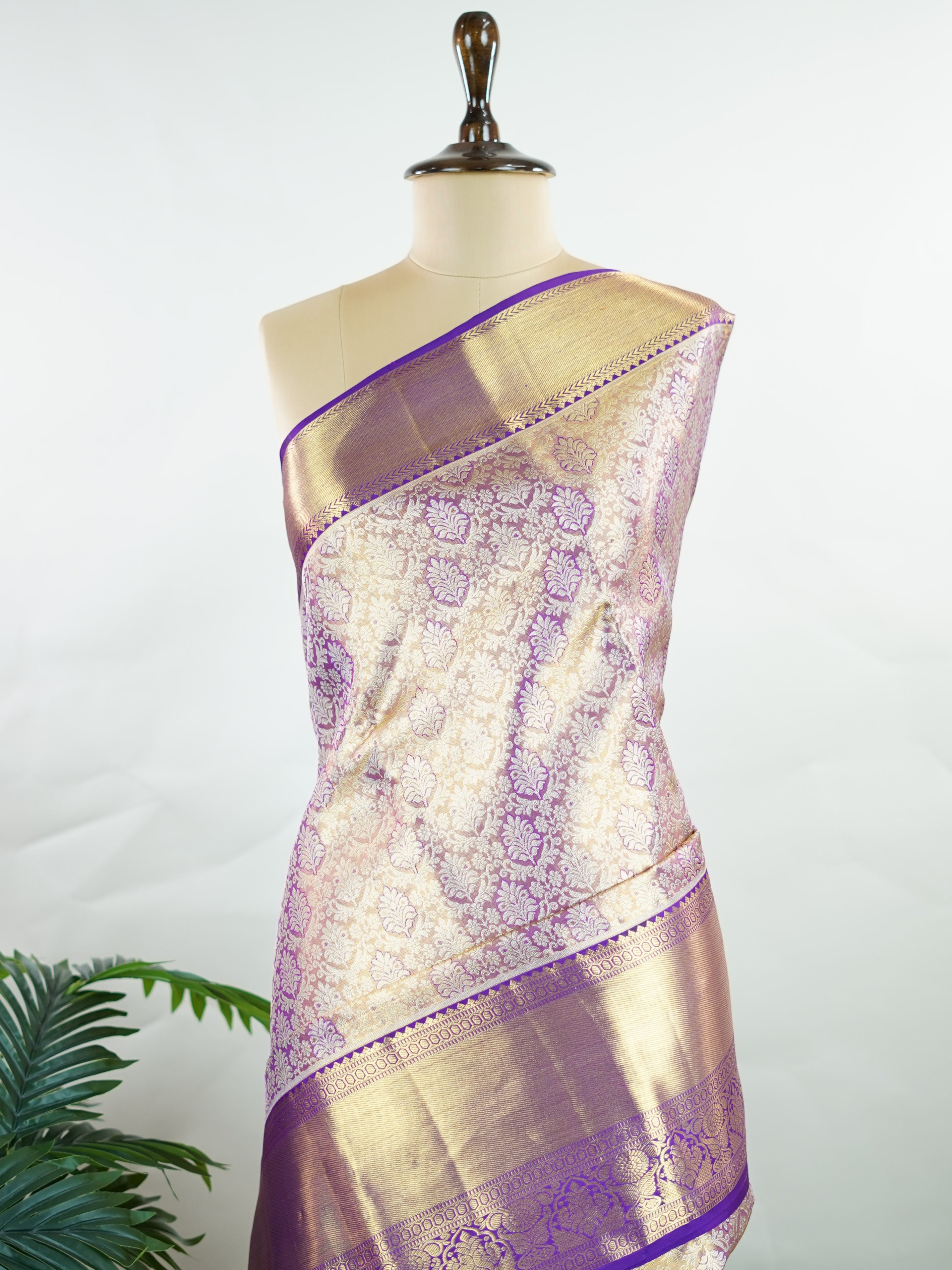 Kanchipuram Silk Beautiful bridal Kanjivaram Tissue saree featuring a luminous Lavender body, gracefully complemented by a matching Lavender border and elegant pallu. The delicate tissue weave adds a radiant shimmer, enhancing the saree’s luxurious and ethereal appeal. Expertly crafted with timeless Kanjivaram artistry, this drape exudes sophistication, grace, and bridal elegance. Paired with a matching Tissue Lavender blouse, it is a perfect choice for weddings, receptions, and grand celebrations. Ishvika 